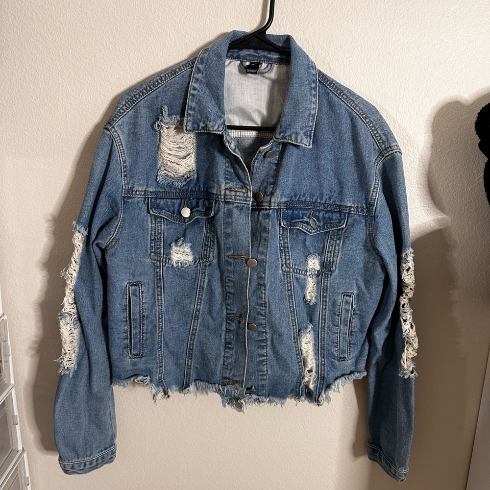 Denim jacket with rips